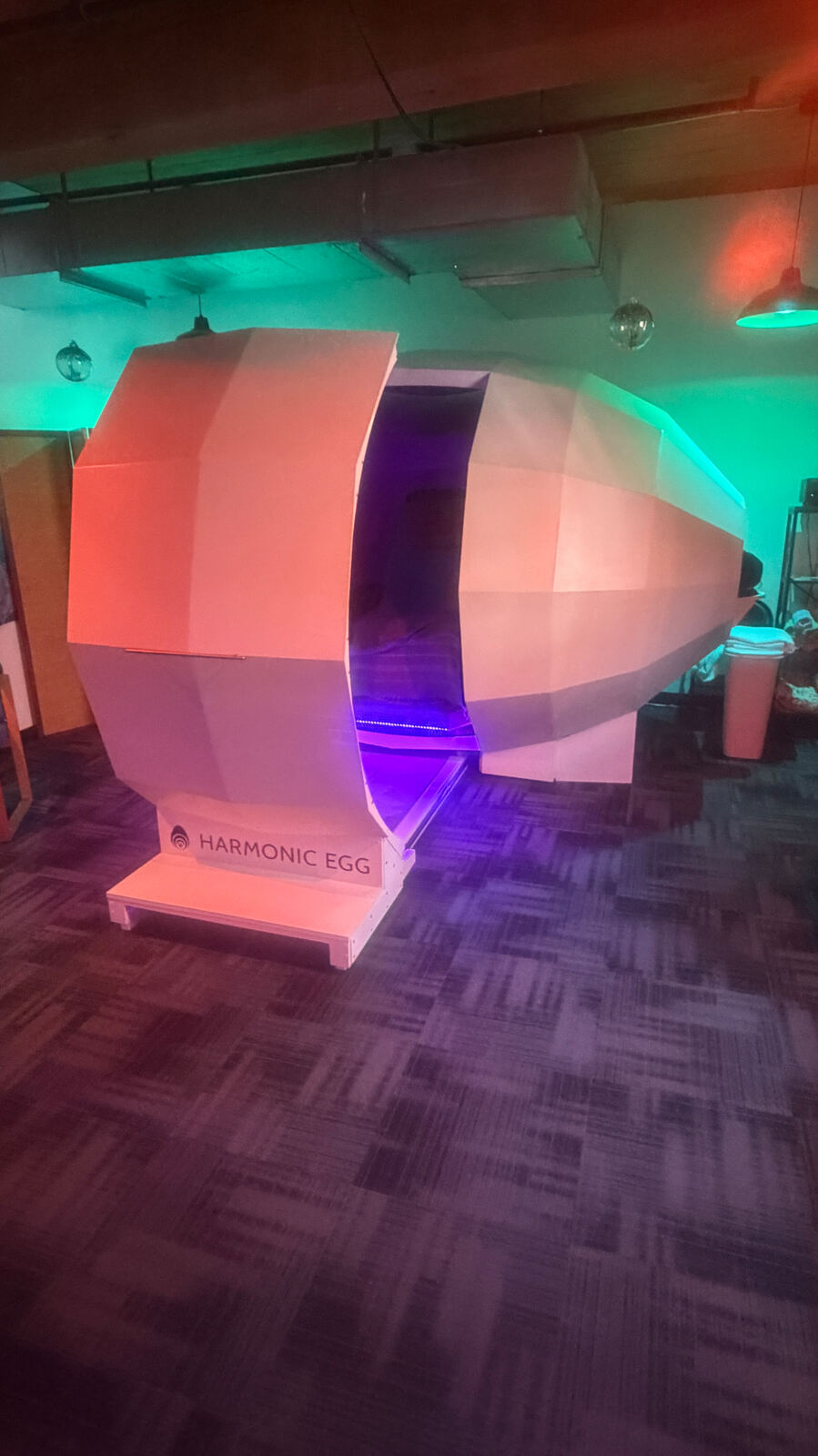 The open doorway of the Harmonic Egg® glowing violet - Harmonic Egg Saco