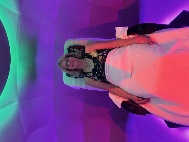 A guest reclined inside the Harmonic Egg® during a session at Harmonic Egg Saco