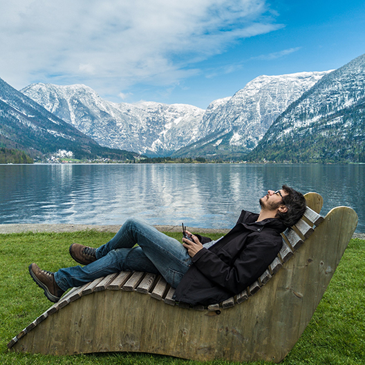 A person seated at ease during a remote Harmonic Egg® session with Harmonic Egg Saco
